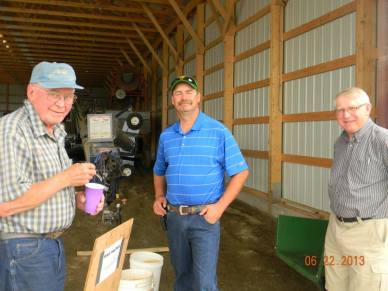 Cousin Charlie (in blue) farms just down the road. He is talking with Alton & Uncle Jim 